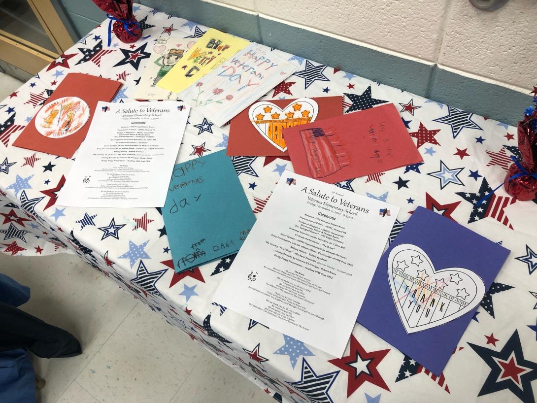 Cards and program for Veterans ES' Veteran's Day event.