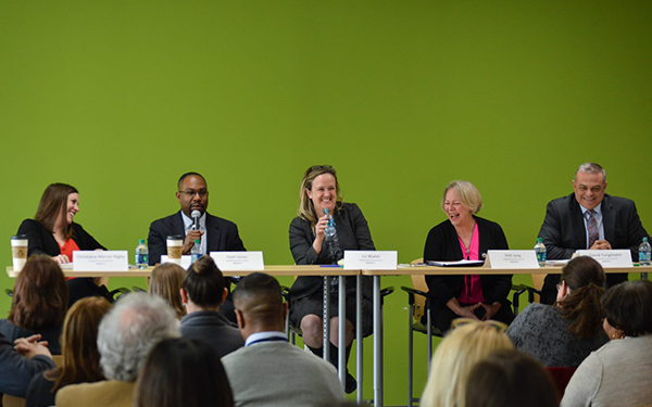 Council members laughing during an ACS panel