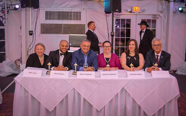 Council members seated at a judge's table